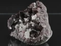 Kolekcjonerski okaz aksynitu z kwarcem z Peru.